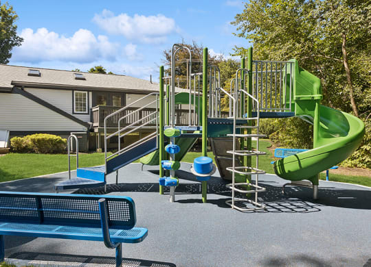 Community Playground with a Slide at Middlesex Crossing Apartments located in Billerica, MA.