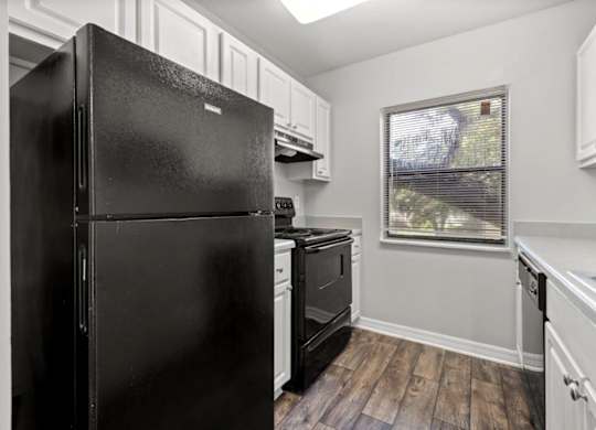 Model kitchen at Oasis at Bayside Apartments in Largo, FL