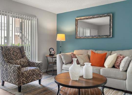 Model living room at Oasis at Bayside Apartments in Largo, FL