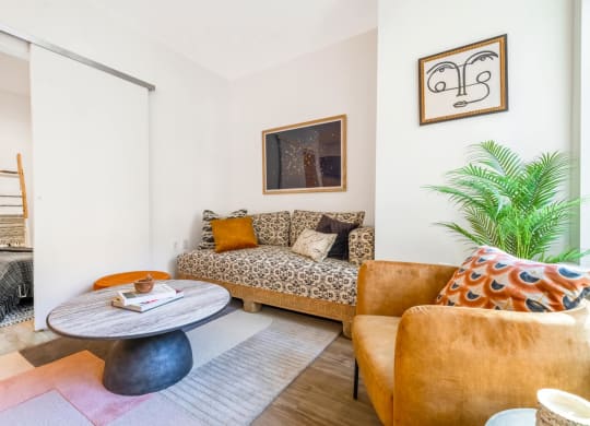 Model living room with a couch and a table