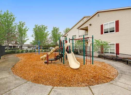 Community Playground with Slide at Landings at Morrison Apartments located in Gresham, OR.