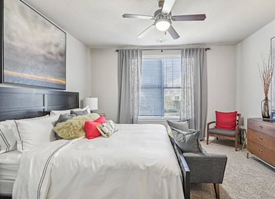 Model bedroom with queen bed.