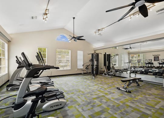 Fitness center with equipment at Vue at Baymeadows Apartments in Jacksonville, Florida