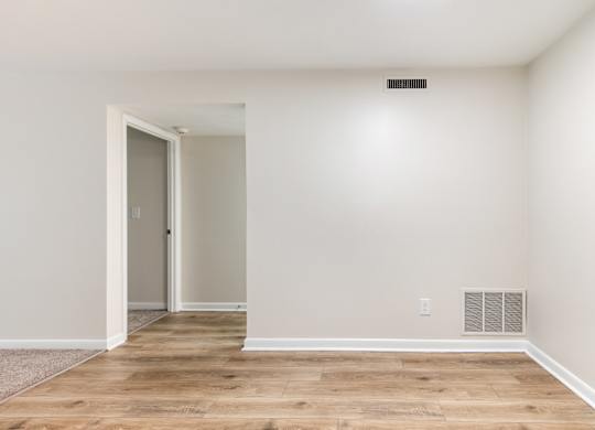 A room with a door and a window.