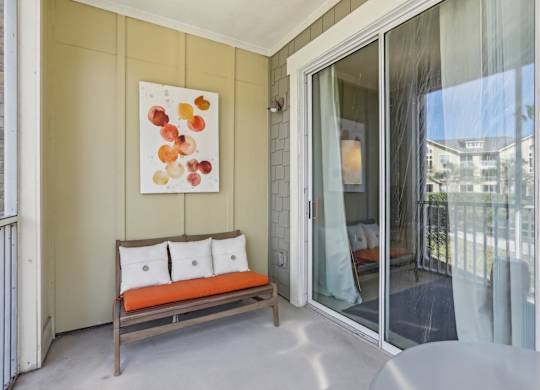 Model balcony with patio furniture.