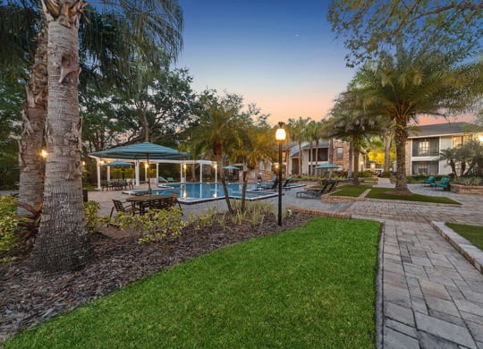 Community Swimming Pool and Landscape at Grand Pavilion Apartments in Tampa, FL.