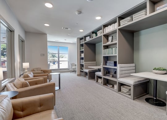 a room filled with furniture and a large window
