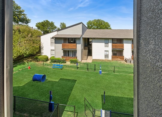 Community Dog Park with Agility Equipment at Summit Ridge Apartments located in Arlington, TX.
