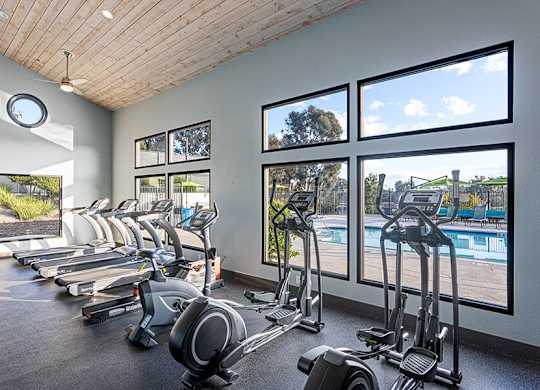 Community Fitness Center with Equipment at Santa Fe Ranch Apartments located in Carlsbad, CA.