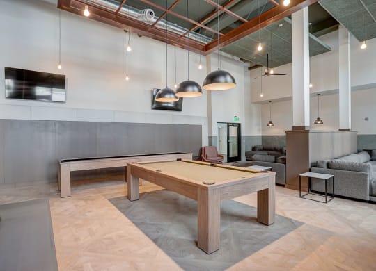 pool table in clubhouse at the district flats apartments in lenexa