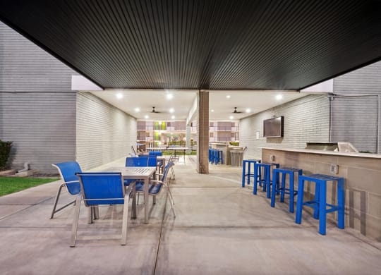 Outdoor BBQ Area with Furniture at Arcadia on 49th Apartments located in Phoenix, AZ.