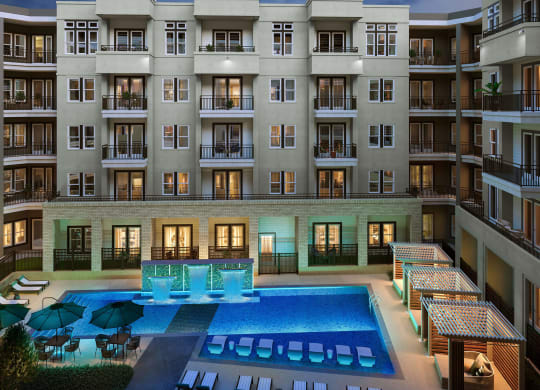 a rendering of an apartment building with a large pool