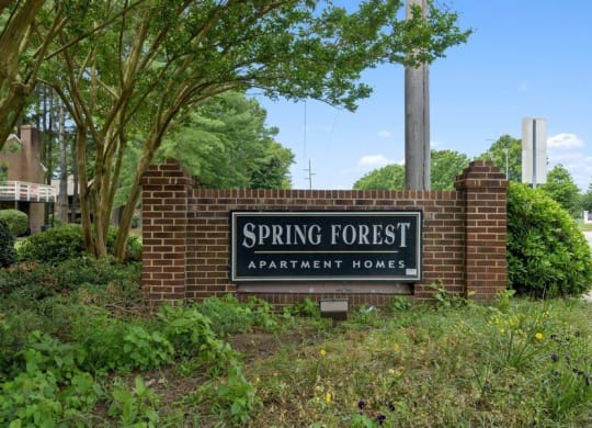 Property entrance sign and landscape
