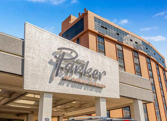 The Parker at Mike's Station building has a large sign on the front.