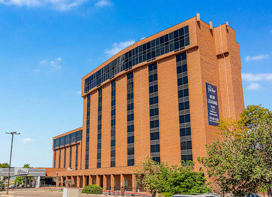 A large orange building with a sign that reads