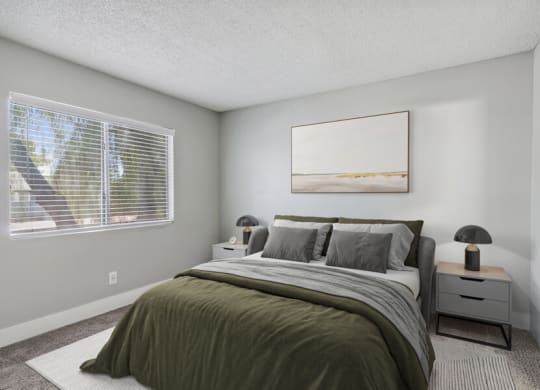 an empty bedroom with a bed and a window