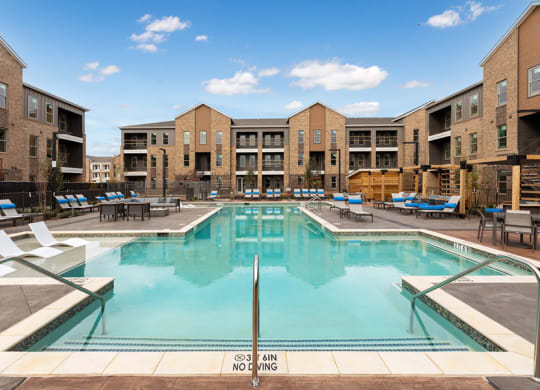Swimming pool at Alta 3Eighty Apartments in Aubrey, TX