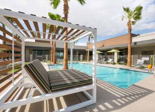 Cabana bed next to swimming pool