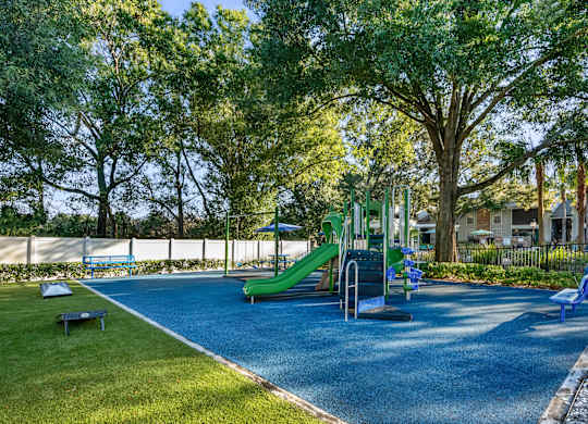 Community playground with composite play top at Grand Pavilion Apartments in Tampa, FL