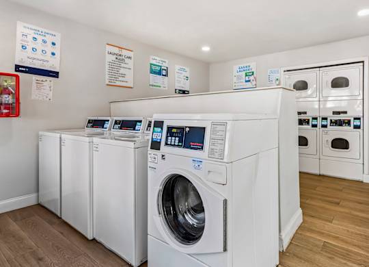 Community laundry room with washers and dryers at Haven at Water's Edge.