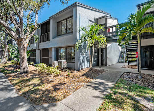 External Community apartment building with walkway at Huntington Place in Sarasota, Florida.