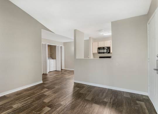 Model living room with hard wood vinyl flooring at Mirage on Kernan in Jacksonville, Florida.