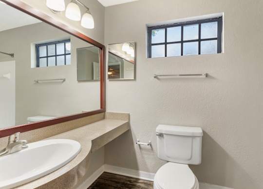 Model bathroom with vanity and toilet at Mirage on Kernan in Jacksonville, Florida.