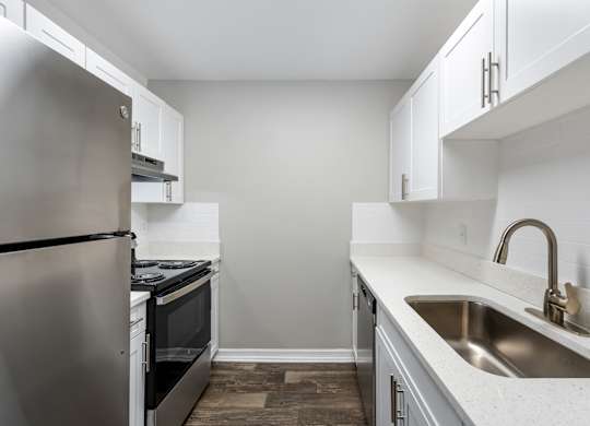 Model kitchen with appliances at Oasis at Bayside in Largo, FL.