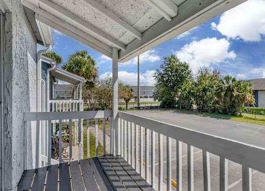Model personal patio overlooking the community parking lot at Park at 7200 in Jacksonville, Florida.