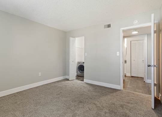 Model bedroom with carpet at Seven Lakes at Carrollwood in Tampa, Florida.