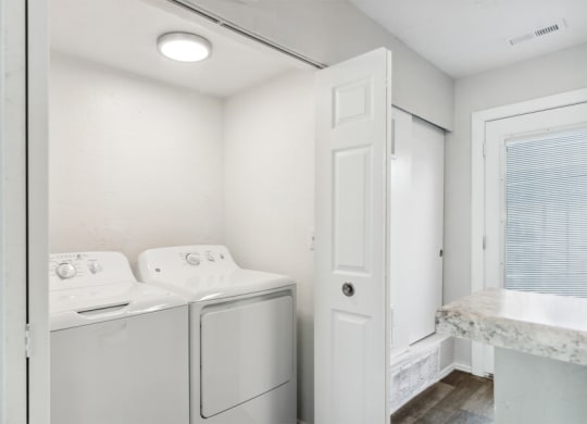 a laundry room with a washer and dryer