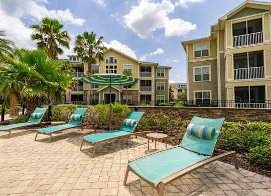 Loungers surrounding pool at Bridges at Crosstown in Tampa, FL