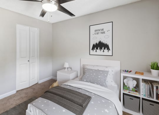 a bedroom with a bed and a ceiling fan