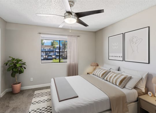 a bedroom with a large white bed and a ceiling fan