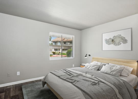 a bedroom with a bed and a window