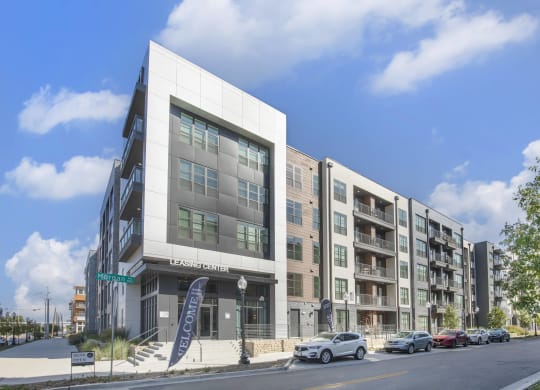 a rendering of an apartment building on a city street