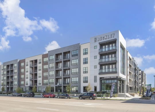 a rendering of an apartment building on a city street