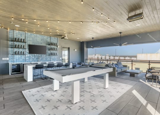 a clubhouse with a ping pong table in the middle