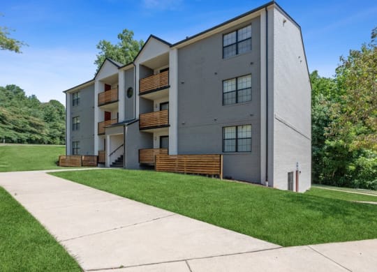 Apartment building exterior with lush greenery