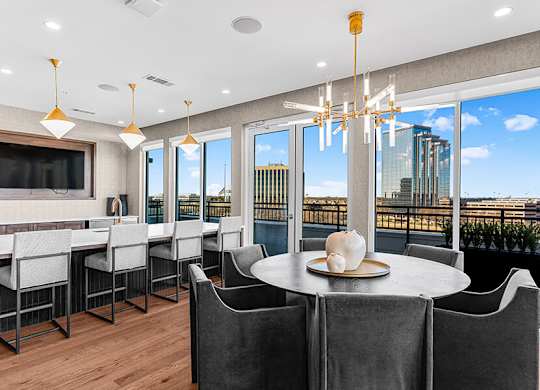 Community Clubhouse with Kitchenette at Ovation at Galatyn Park Apartments located in Richardson, TX.