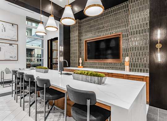Community Clubhouse Kitchenette Area at Ovation at Galatyn Park Apartments located in Richardson, TX.