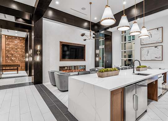Community Clubhouse Kitchenette Area at Ovation at Galatyn Park Apartments located in Richardson, TX.