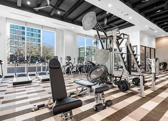 Community Fitness Center with Equipment at Ovation at Galatyn Park Apartments located in Richardson, TX.