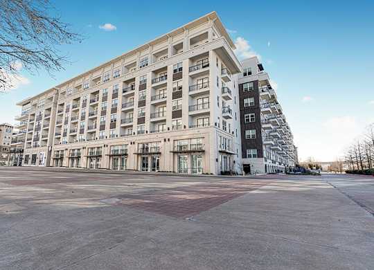Exterior Community Building at Ovation at Galatyn Park Apartments located in Richardson, TX.