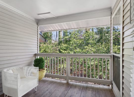 Apartment porch with a white chair