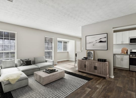 Model apartment living room with a couch and a coffee table