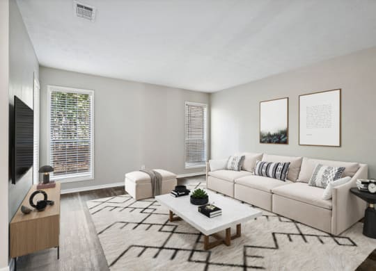 Model living room of an apartment with a couch and a coffee table