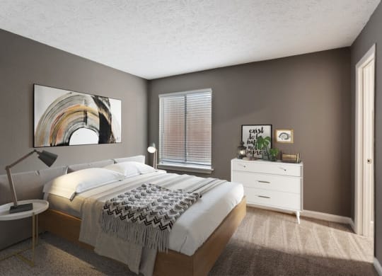 Norcross, GA Pet-Friendly Apartments - Elevate at Jackson Creek - Bedroom With White Upholstered Bed, Matching Nightstands, and Plush Carpeting
