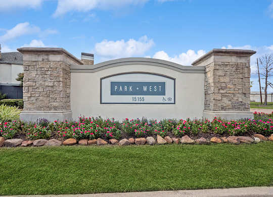 Monument Sign and Front Entrance at Park West Apartments located in Houston, TX.