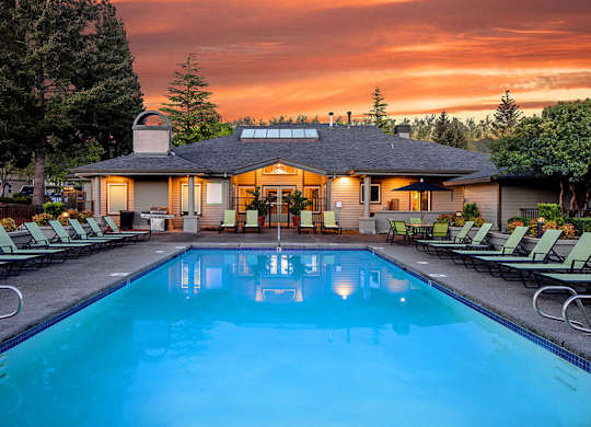 Resort style swimming pool at dusk